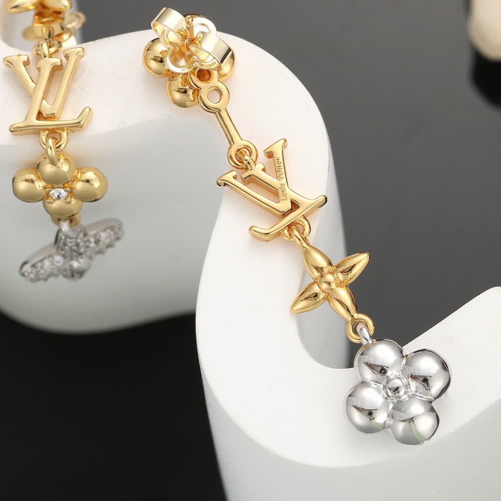 Louis Vuitton Gold Tone Earrings with Monogram and Crystal Flower